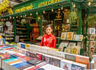 33 Best Things to Do in Ho Chi Minh City for First-Timers — From Iconic to Less Touristy Recommendations Lady Browsing Books - Ho Chi Minh City Budget Itinerary
