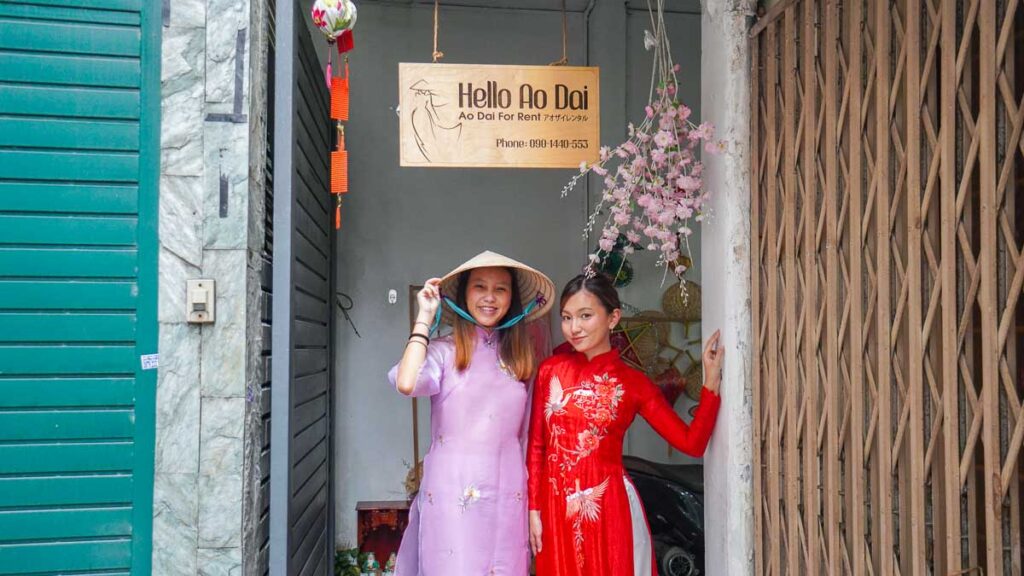 Girls in ao dais at the entrance of rental store - Ho Chi Minh City Girls Trip
