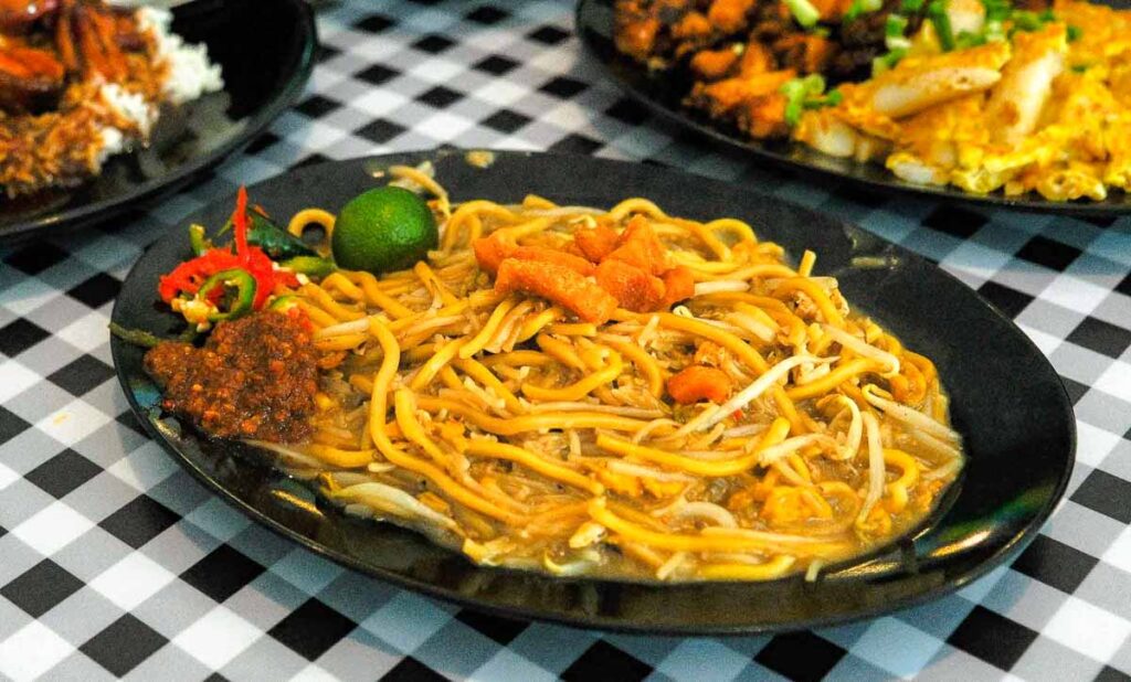 A plate of Hokkien Mee in a hawker centre - things to do in punggol