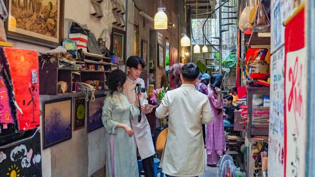 People in ao dais taking photos - Ho Chi Minh City Things to Do