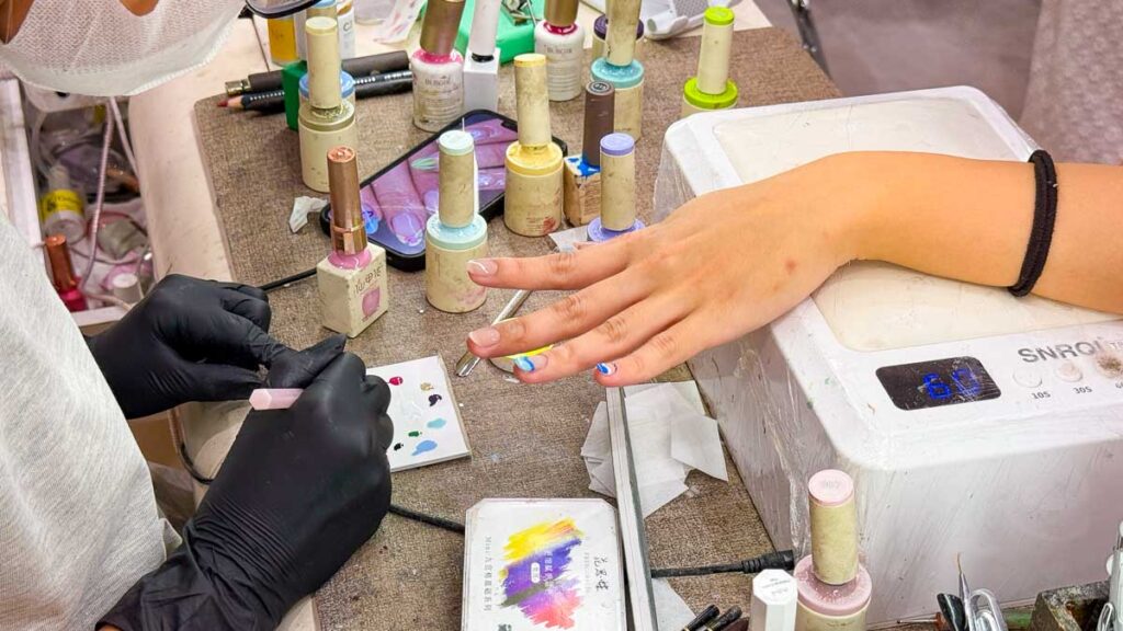 Girl getting her nails done at nail salon - Ho Chi Minh City Girls Trip