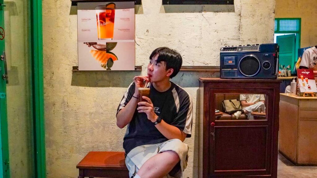 Boy drinking drink in cafe - Ho Chi Minh City Cafes