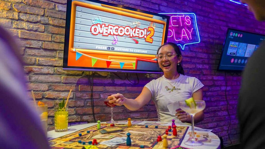 Girl playing board games at a bar - Ho Chi Minh City Girls Trip