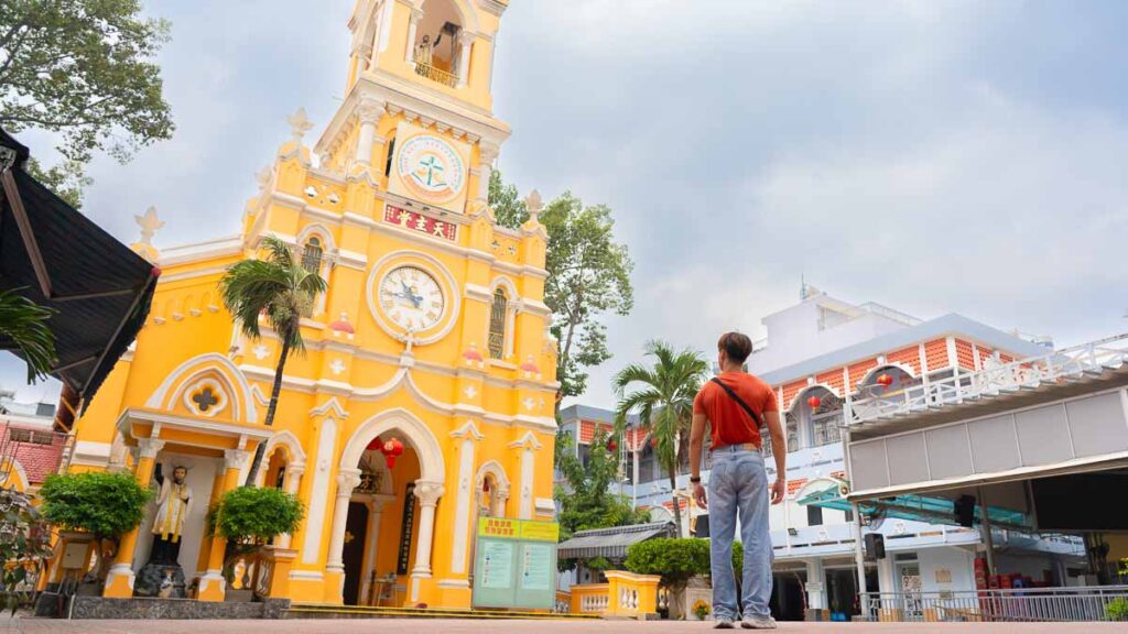 Man standing in front of Church - Ho Chi Minh City Budget Itinerary
