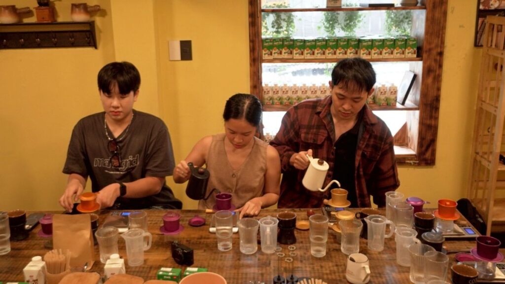 Tourists taking a coffee workshop - Things to Do in HCMC