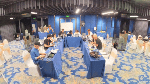 A group of people working in a hotel room  - Ho Chi Minh City Bootcamp TTI21
