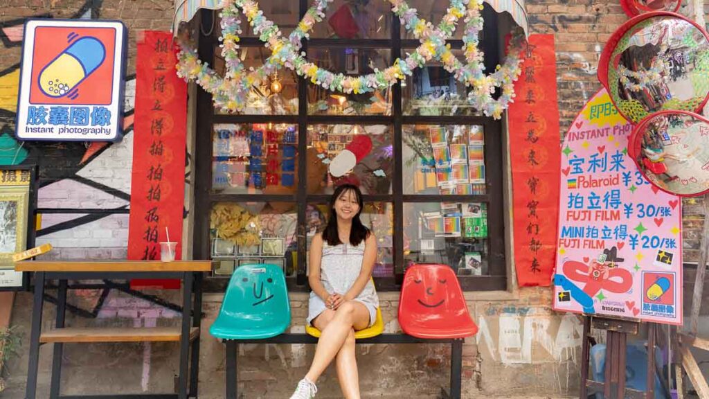 Girl in front of a Polariod Shop - Beijing Itinerary