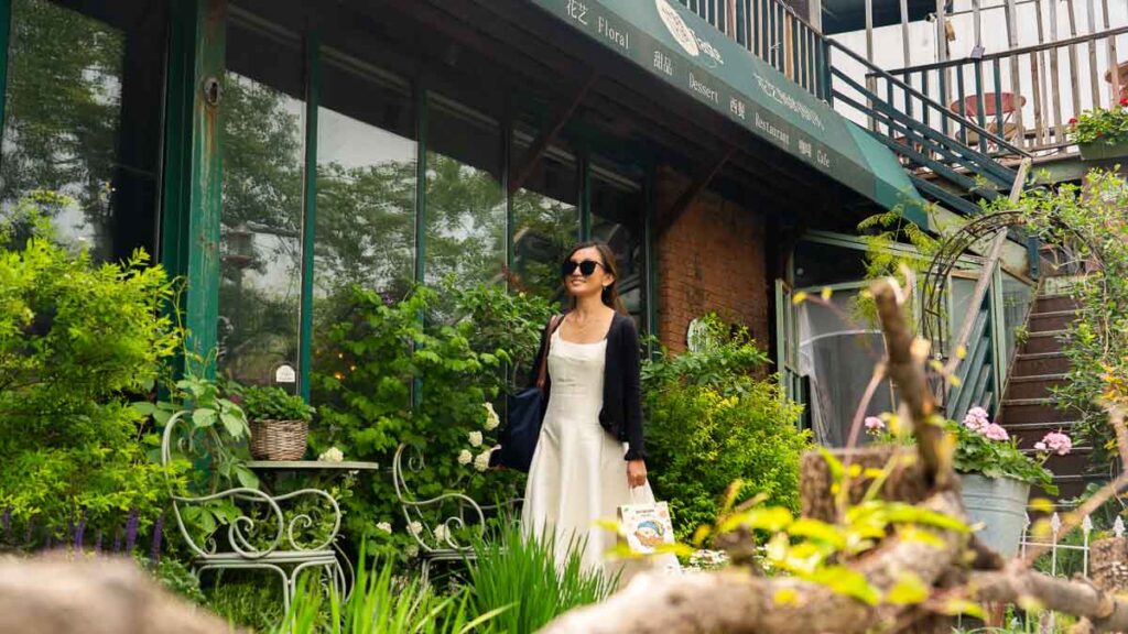 Girl outside a cafe exterior- Beijing Itinerary