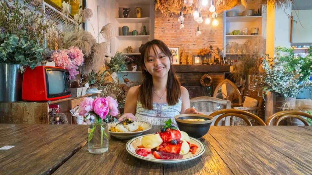 Girl in front of cafe food - Beijing Itinerary