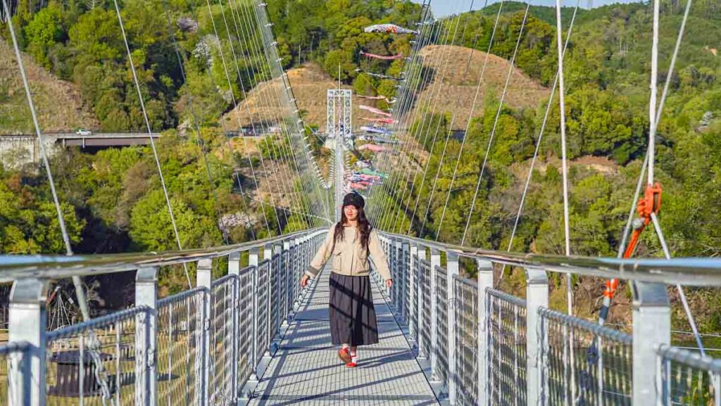 Girl walking along bridge - Non-touristy Osaka