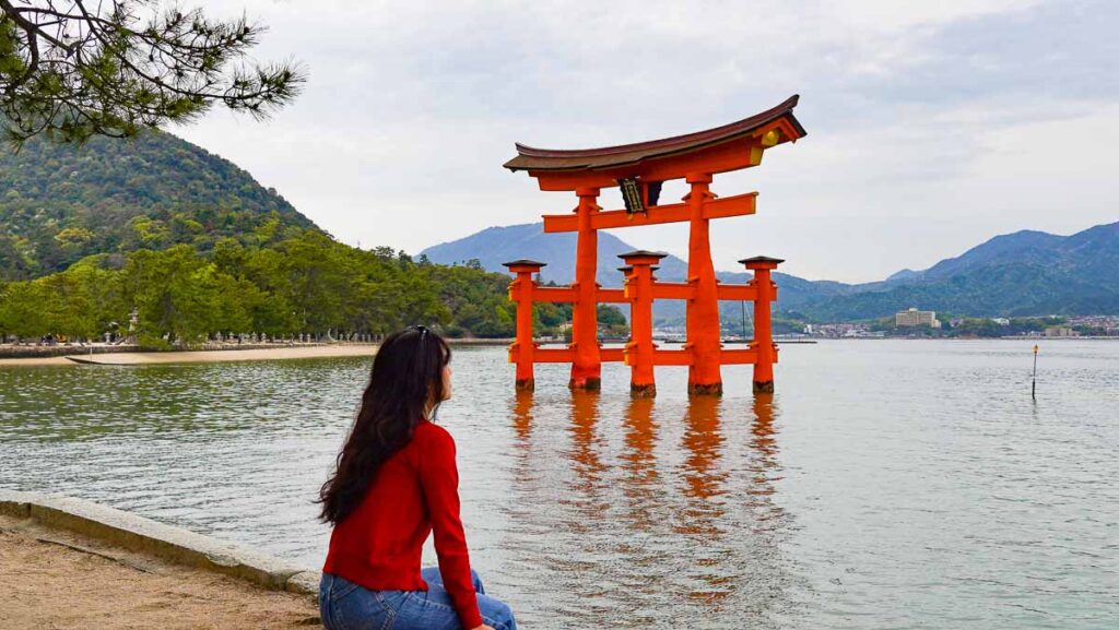 Girl looking at shrine - Osaka for repeat travellers