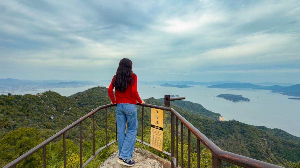 Girl looking out at viewpoint - Day trips from Osaka  