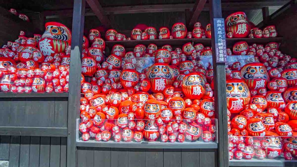 Wall with daruma - Lesser-known things to do in Osaka