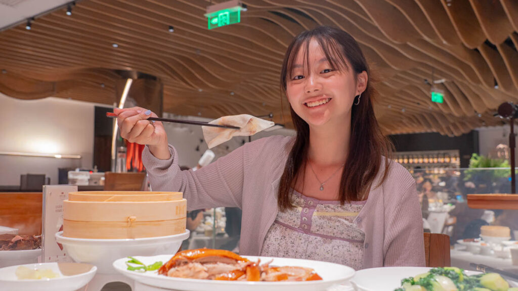 Girl holding Peking Duck - Beijing Itinerary.jpg