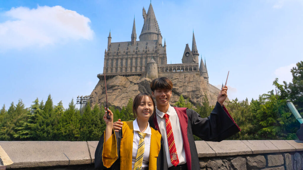 Boy and girl standing against Universal Studios Beijing Backdrop - Beijing Itinerary