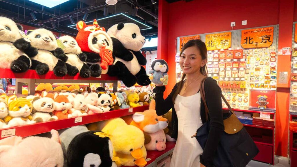 Lady posing with soft toys at WangFuJing Shopping Mall - Beijing Itinerary