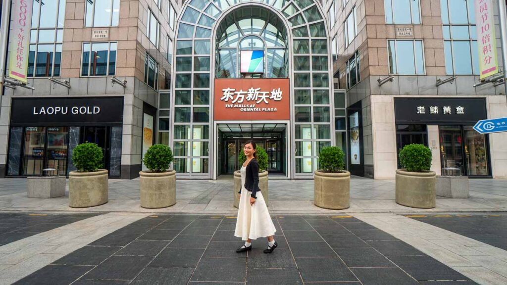 Lady outside a Shopping Mall Entrance - Beijing Itinerary