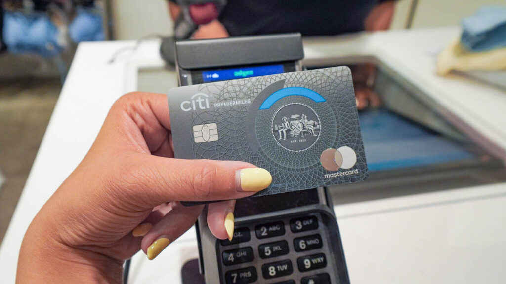 Tapping credit card at card machine - Vancouver travel tips
