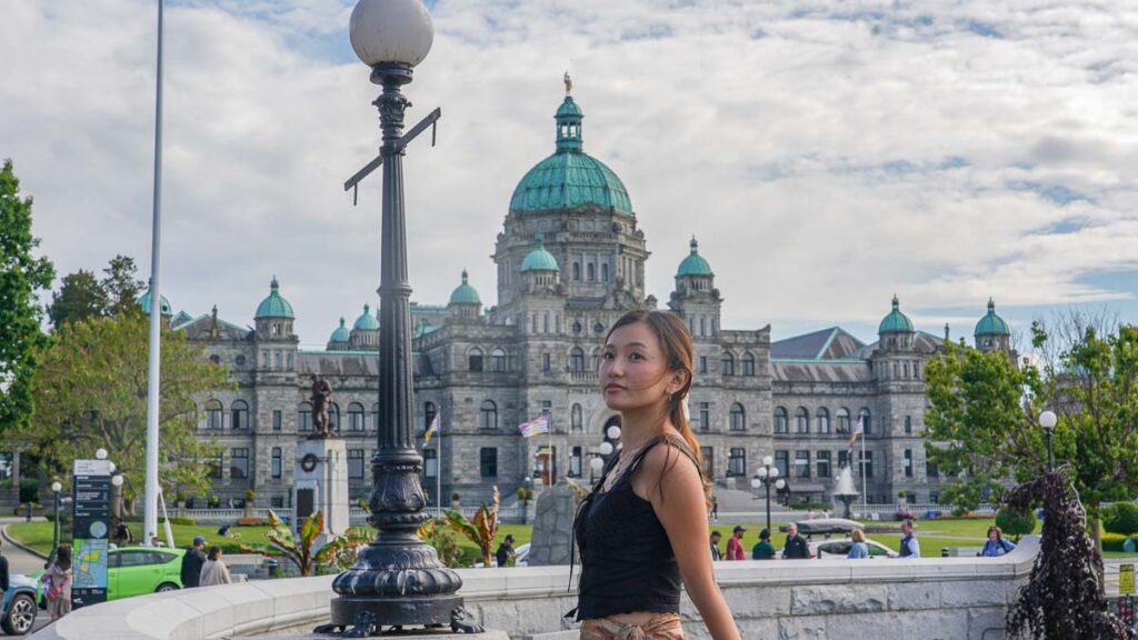 Girl posing in front of legislative building - First-timers in Vancouver