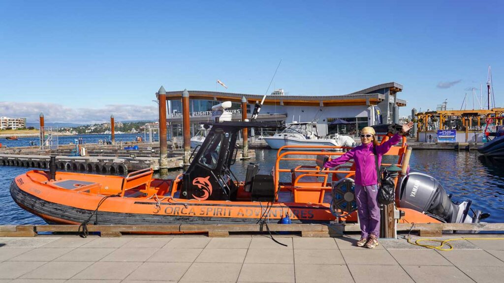 Girl with orange zodiac boat - Vancouver day trips