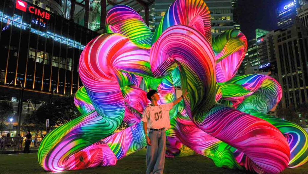 Man looking at art exihibit - Things to do in Singapore June