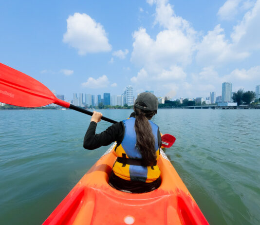Kallang Neighbourhood Guide — A Low-key 1-Day Itinerary For Your Next Offline Day Girl Kayaking in Kallang - Kallang Neighbourhood Guide