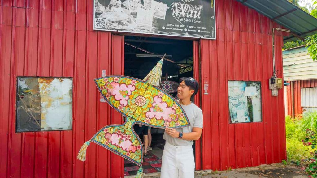 Man holding Wau at Galeri Wau Pak Sapie and Sons - Things to do in Kota Bharu