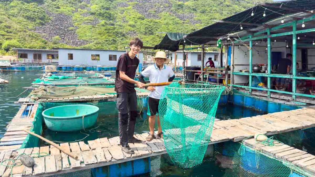 Boy with fish net at fish restaurant - Nha Trang attractions