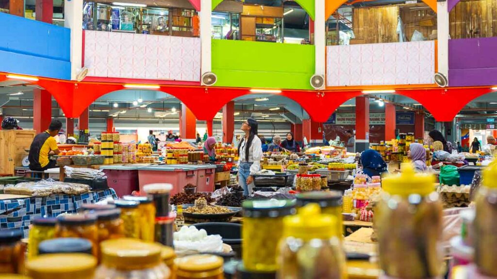 Girl walking through Siti Khadijah Market 