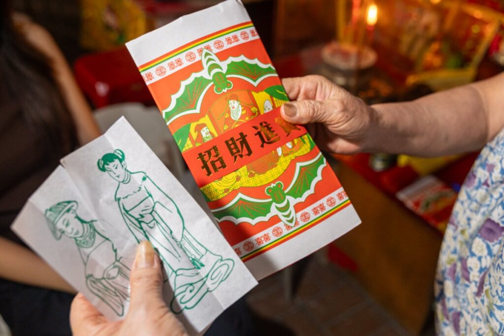 Villain hitting master holds out paper effigies of two genders - RITUALS (NTU GO-FAR 2026)