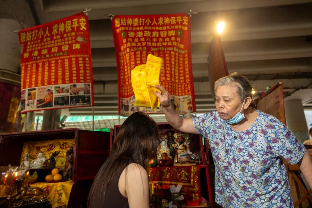 Villain hitting master waves a talisman over a client's head - RITUALS (NTU GO-FAR 2026)