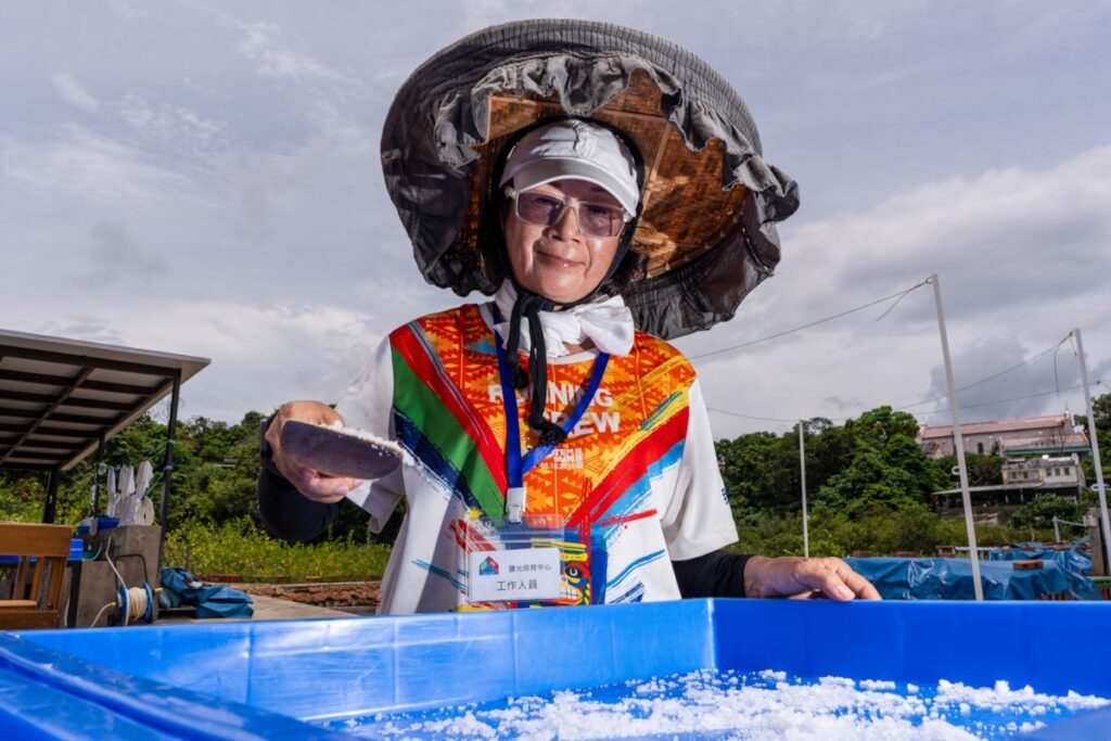 Windy Tang harvests crystals on Yim Tin Tsai’s salt pans - RURAL ROOTS (NTU GO-FAR 2026)